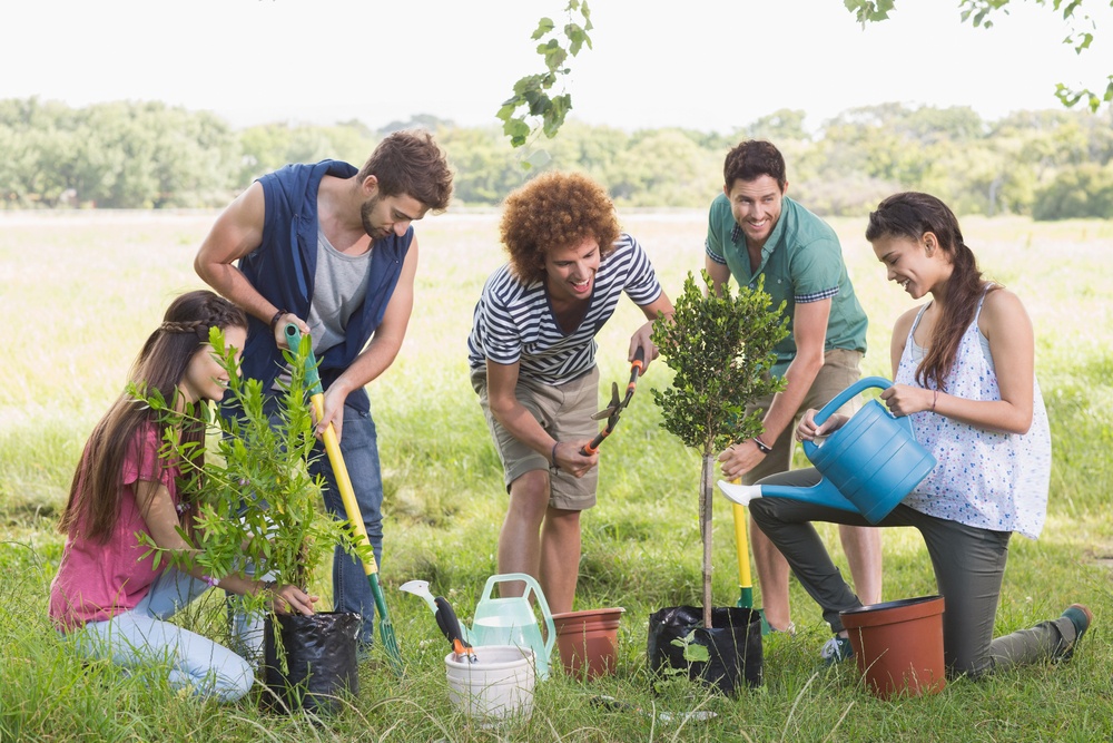 Happy friends gardening for the community on a sunny day.jpeg