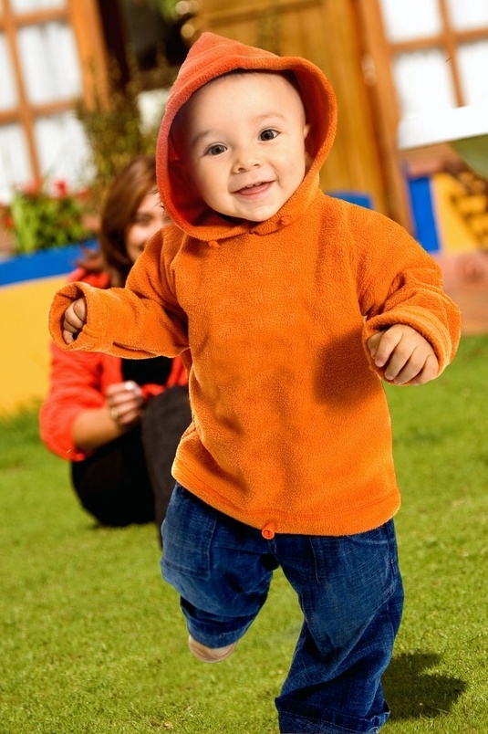 boy having fun outdoors while performing his first few steps on a sunny day at the garden - mum in the background-201127-edited.jpeg